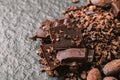 Dark chocolate pieces crushed and cocoa beans, top view Royalty Free Stock Photo