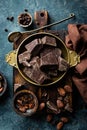 Dark chocolate pieces crushed and cocoa beans Royalty Free Stock Photo