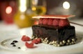 Dark chocolate tart with raspberry wafer Royalty Free Stock Photo