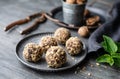 Dark chocolate truffle coated in chopped and toasted walnuts on a plate Royalty Free Stock Photo