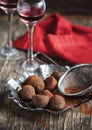 Dark chocolate truffles and two glasses of raspberry liqueur Royalty Free Stock Photo