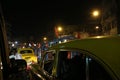 Dark city traffic blurred in motion at late evening on crowded streets in Kolkata