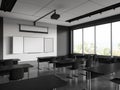 Dark class room interior with chairs in row and blackboard with screen, window Royalty Free Stock Photo