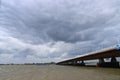 Dark clouds above the Moerdijkbrug over water named Hollands Diep