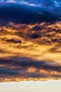 Dark clouds and bright sunlit sky