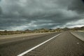 Dark Clouds, Desert Highway Royalty Free Stock Photo