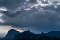 Dark clouds in the evening over the mountains.