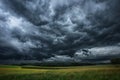 Dark clouds gather, lightning strikes, and rain pours fiercely, signaling an imminent tempest.