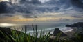 Dark clouds gather over Piha