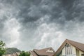 Dark clouds going to heavy rain over the house roof