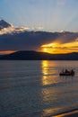 Dark clouds over Alghero shore at sunset Royalty Free Stock Photo