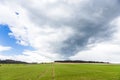 Dark clouds over fields in spring