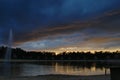 Dark clouds over the lake of Landgoed `t Loo awaiting of a thunderstorm and rain.