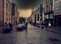 Dark clouds over Oslo famous shopping street Karl Johan