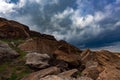 Dark clouds over rocks Royalty Free Stock Photo