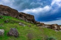 Dark clouds over rocks Royalty Free Stock Photo