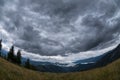 Dark clouds over a valley in the Carpathians mountains