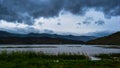 Dark clouds, rain over the lake. Dramatic rainy sky over the lake . Dark blue storm clouds. Royalty Free Stock Photo