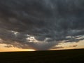 Dark clouds red sun at sunset day Royalty Free Stock Photo