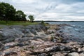 Dark clouds and wild rocks at the coastline of the Baltic Sea Royalty Free Stock Photo