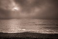 Dark and cloudy dawn on the beach