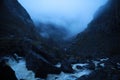 Dark and cloudy Norwegian morning. Rain in Norway. Fog in the mountains. Languid mountains. Stones. Boulder. Rock. Waterfalls in t