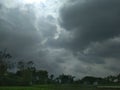 Dark cloudy sky before rain in the field Royalty Free Stock Photo