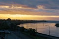 Dark cloudy sky in sunset colours over Grey River and West Coast