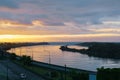 Dark cloudy sky in sunset colours over Grey River and West Coast