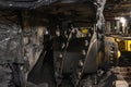 Dark coal mine tunnel with minimal light, showing deep stope and active coal extraction. Royalty Free Stock Photo