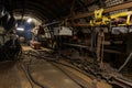 Dark coal mine tunnel with minimal light, showing deep stope and active coal extraction. Royalty Free Stock Photo
