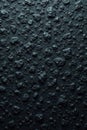 Dark, coarse grained black stone; uneven, textured surface , design texture, rough, dark grey stone Royalty Free Stock Photo