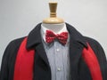 Dark coat with red scarf and bowtie