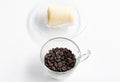 Dark coffee beans with soft roll cake. Royalty Free Stock Photo