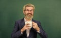 Dark coffee, bright future. Happy teacher hold coffee cup. Bearded man enjoy drinking coffee. Coffee break. School break