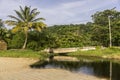 Dark colored river near the beach