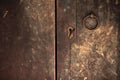 Old style closed wooden door with keyhole