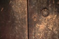 Old style closed wooden door with keyhole