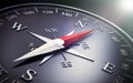 Dark compass with silver and red needle