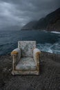 Dark concept of abandoned chair in stormy Ocean