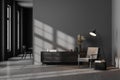 Dark contemporary waiting room interior with wooden sideboard