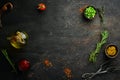 Dark cooking banner. Vegetables and spices on the kitchen table. Top view.