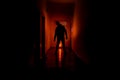 Dark corridor with cabinet doors and lights with silhouette of spooky horror man standing with different poses.