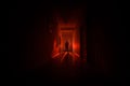 Dark corridor with cabinet doors and lights with silhouette of spooky horror man standing with different poses. Royalty Free Stock Photo