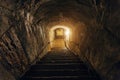 Dark corridor of old abandoned underground Soviet military bunker. Staircase goes down