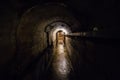 Dark corridor of old underground Soviet bunker under artillery fortification Royalty Free Stock Photo