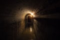 Dark corridor of old underground Soviet bunker under military artillery fortification Royalty Free Stock Photo