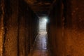 Dark corridor of old underground Soviet military bunker under artillery fortification Royalty Free Stock Photo