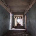 Dark creepy corridor with many doors in abandoned ruined hospital, horror hallway or tunnel Royalty Free Stock Photo