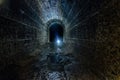 Dark and creepy old historical vaulted flooded underground drainage tunnel